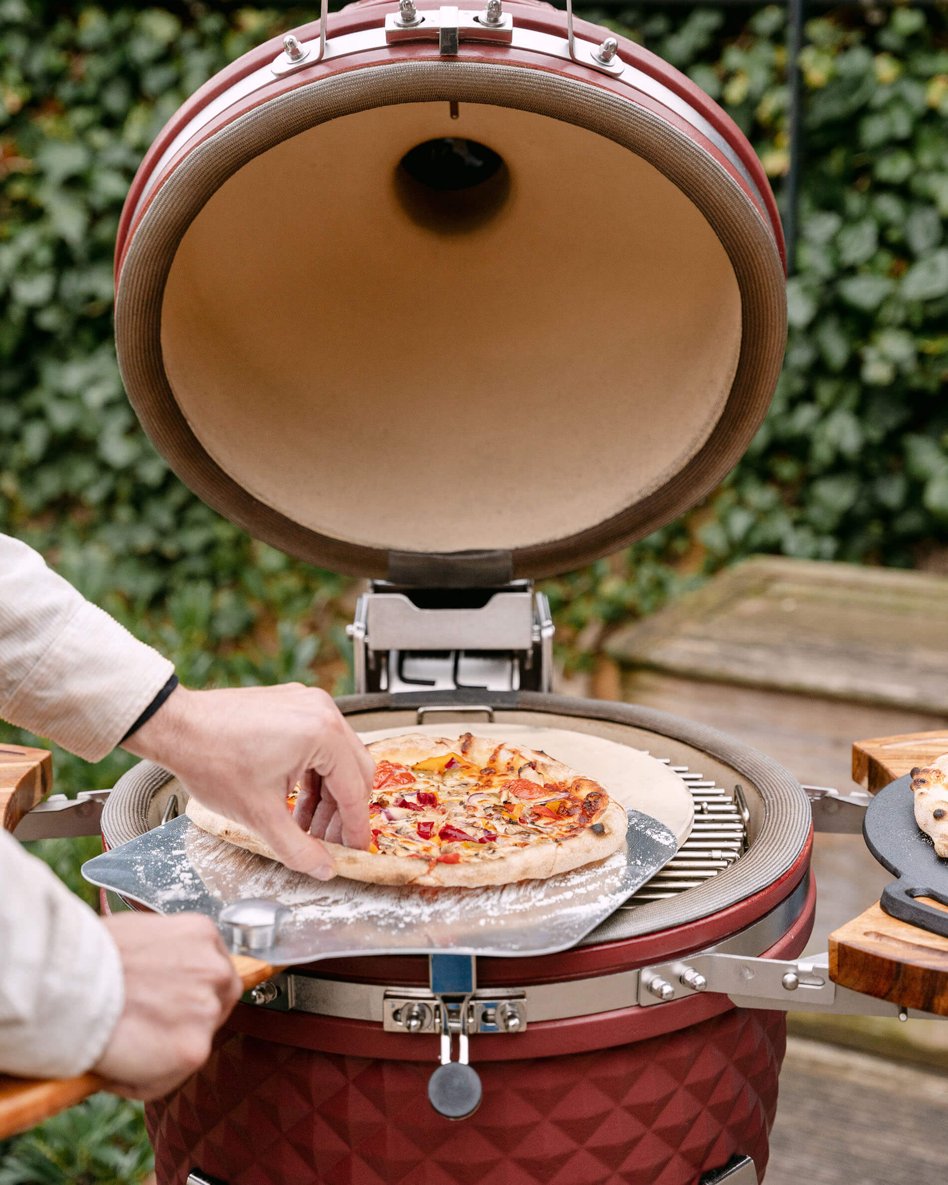 Pala per pizza in acciaio inox e pizze